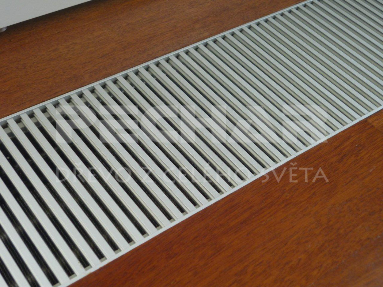 Merbau solid flooring lacquered surface, detail of the cut between wood convector heating